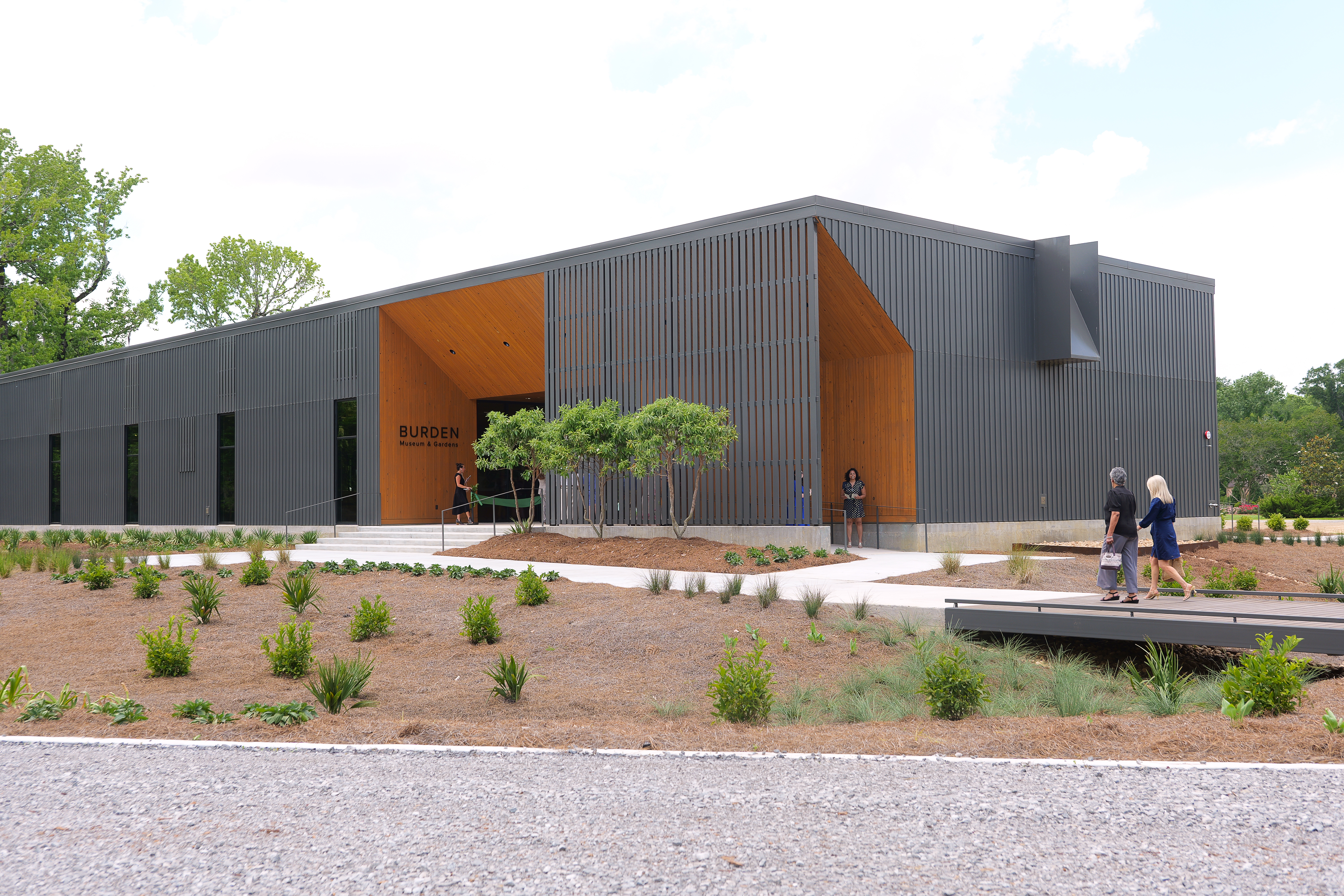 Modern building surrounded by landscaping.